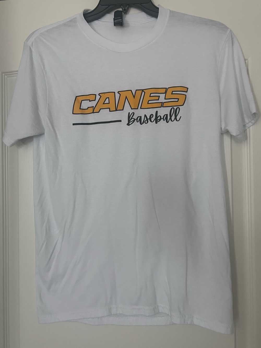 District White Tee with Gold CANES Baseball Logo